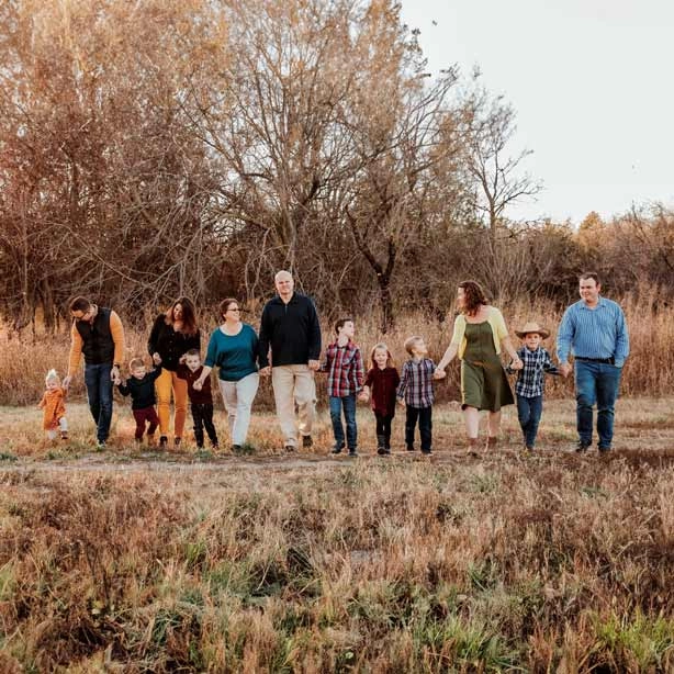 Family group walking together outdoors in Kansas